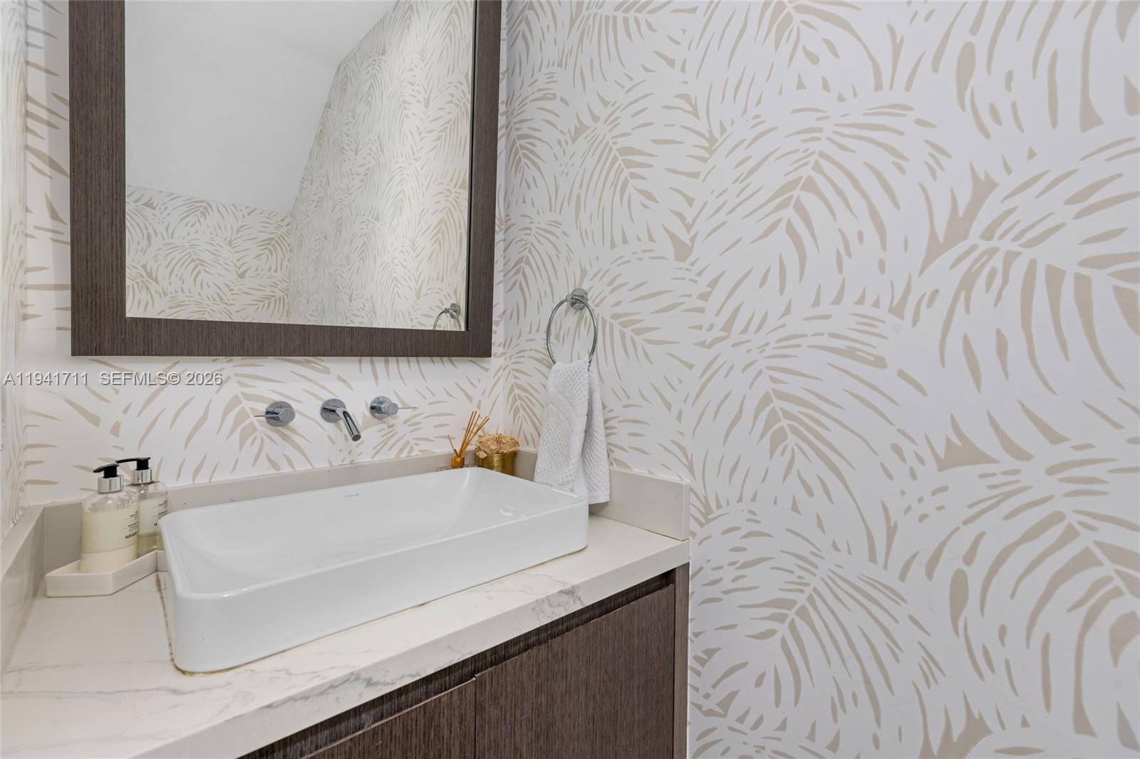 3222 Matilda Street, Unit 3222 Miami, FL 33133 - Photo 24 of 70 a bathroom with a sink and a mirror