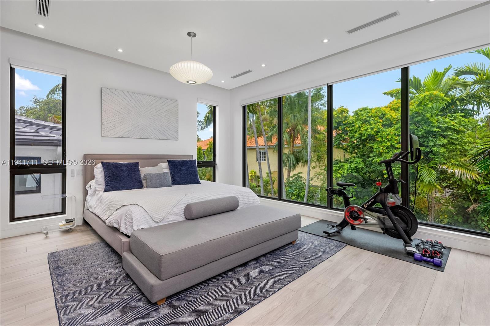 3222 Matilda Street, Unit 3222 Miami, FL 33133 - Photo 26 of 70 a bedroom with a large bed and a large window