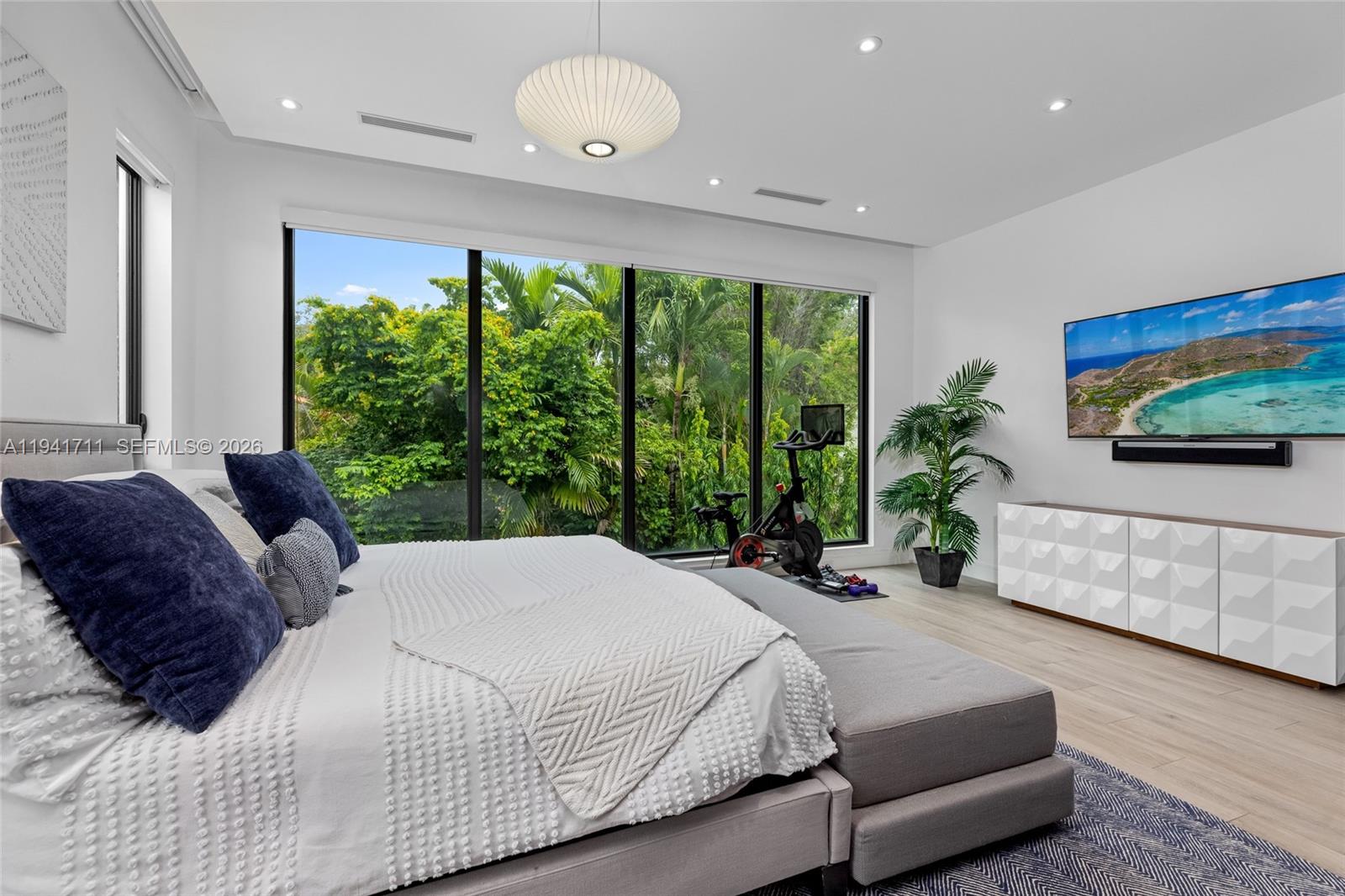 3222 Matilda Street, Unit 3222 Miami, FL 33133 - Photo 27 of 70 a bedroom with a large bed and a large window