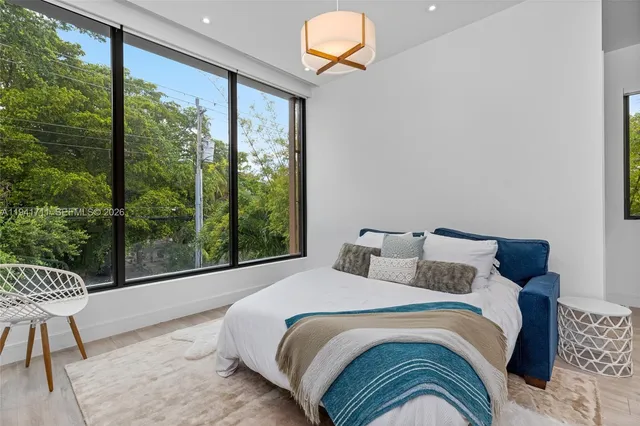 a view of a two chairs in the patio