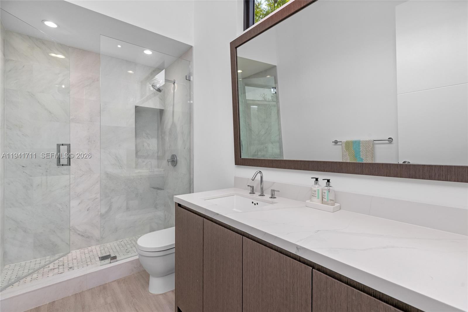 3222 Matilda Street, Unit 3222 Miami, FL 33133 - Photo 42 of 70 a bathroom with a sink a toilet and shower