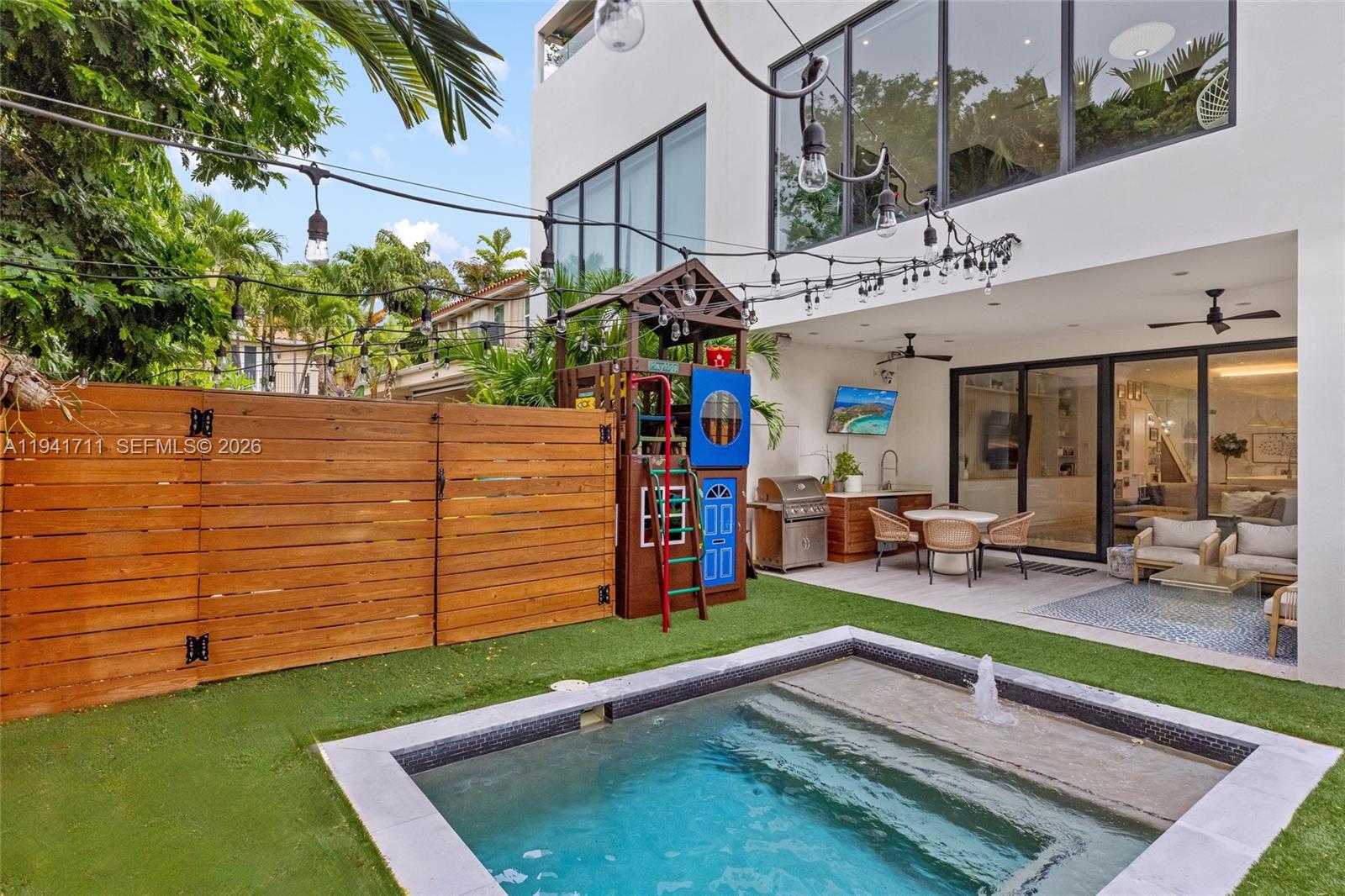 3222 Matilda Street, Unit 3222 Miami, FL 33133 - Photo 50 of 70 a view of a backyard with plants and a patio