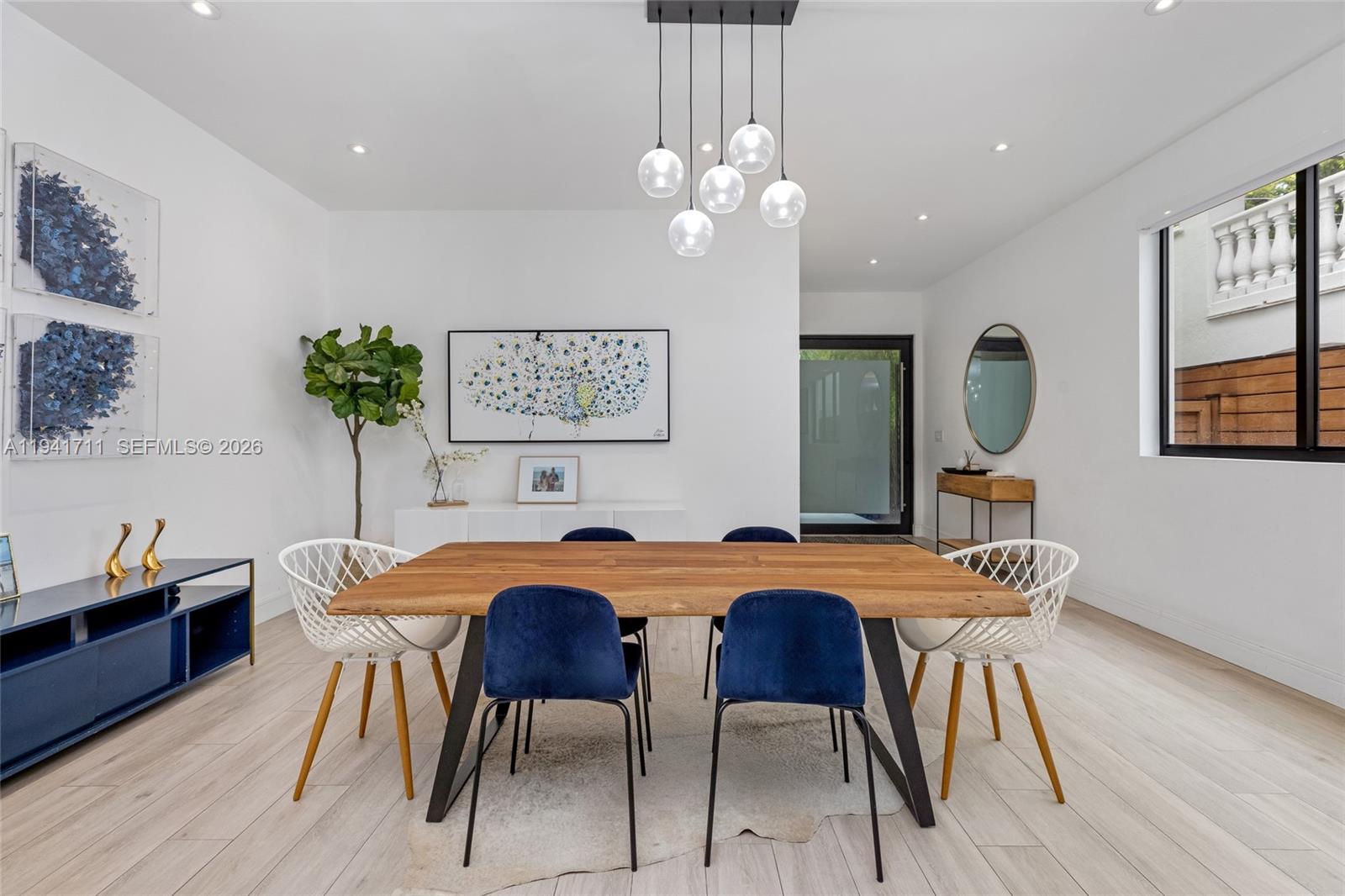 3222 Matilda Street, Unit 3222 Miami, FL 33133 - Photo 8 of 70 a view of a dining room with furniture and wooden floor
