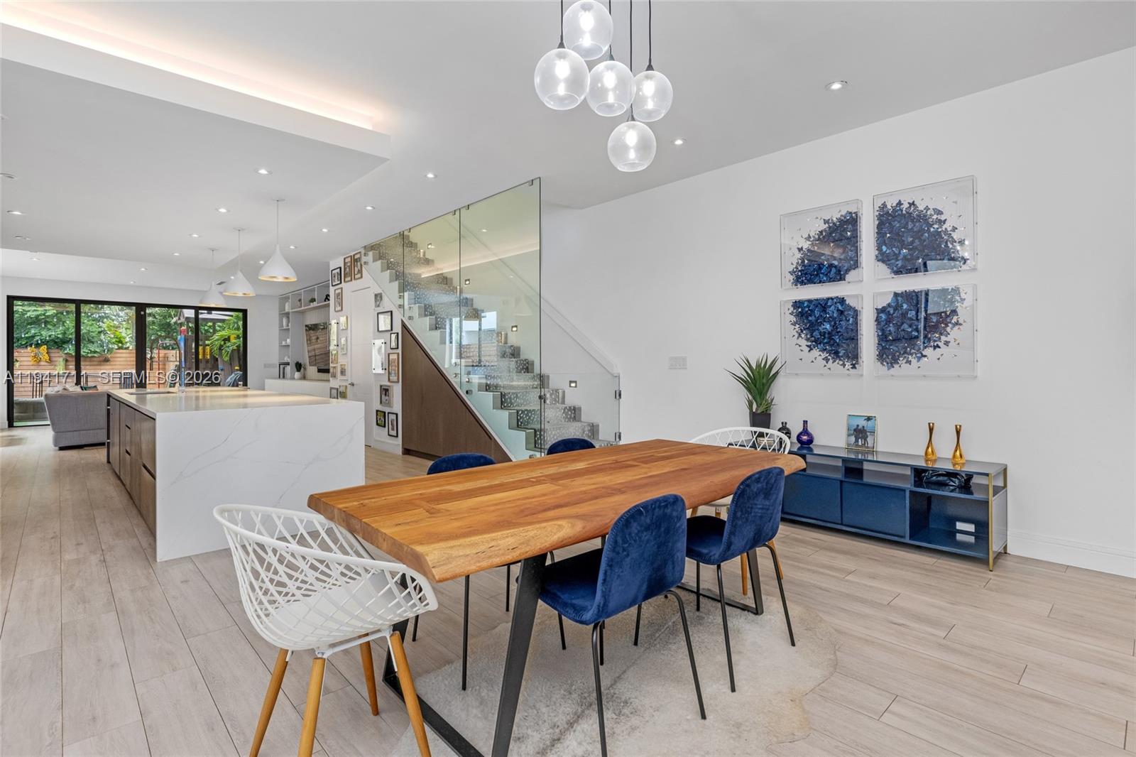 3222 Matilda Street, Unit 3222 Miami, FL 33133 - Photo 10 of 70 a view of a dining room with furniture and wooden floor