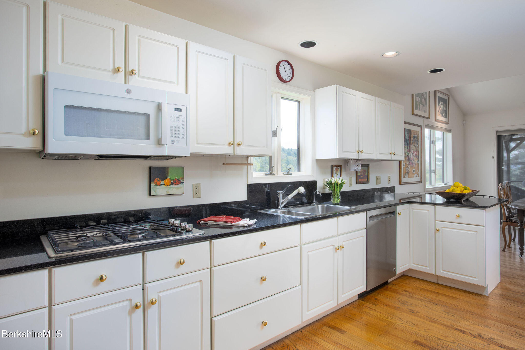 77 Hurlburt Road Great Barrington, MA 01230 - Photo 21 of 48 a kitchen with stainless steel appliances granite countertop a sink stove and cabinets