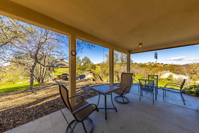 a view of an empty room and wooden floor