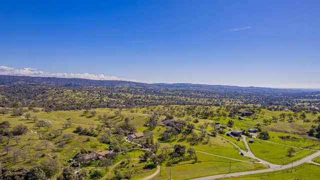 a view of a kitchen with a sink and dishwasher cabinets with wooden floor