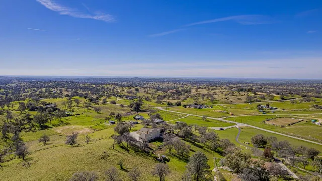 a living room with furniture fireplace and window