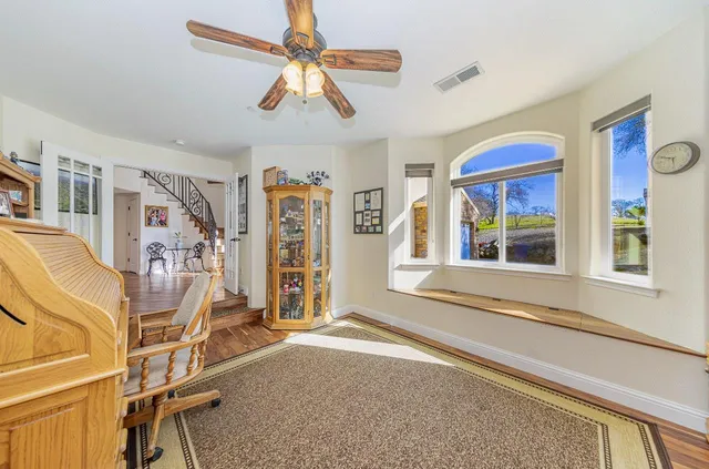 a dining room with furniture and window