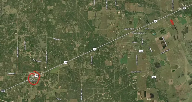 a bathroom with a shower and a sink