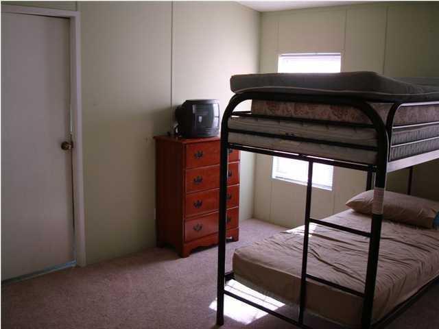 179 13th Street Santa Rosa Beach, FL 32459 - Photo 11 of 21 a hallway with a bed
