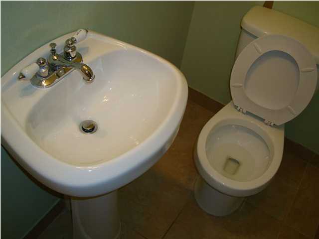 179 13th Street Santa Rosa Beach, FL 32459 - Photo 14 of 21 a bathroom with a toilet and a sink