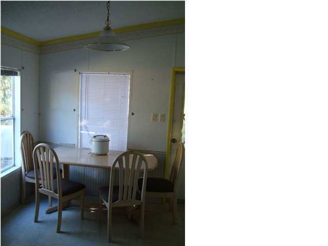 179 13th Street Santa Rosa Beach, FL 32459 - Photo 4 of 21 a view of a dining room with furniture and window