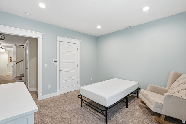 672 Perry Hollow Drive Mapleton, UT 84664 - Photo 58 of 106 Carpeted room featuring light blue walls, white trim, recessed lighting, and a solid core door