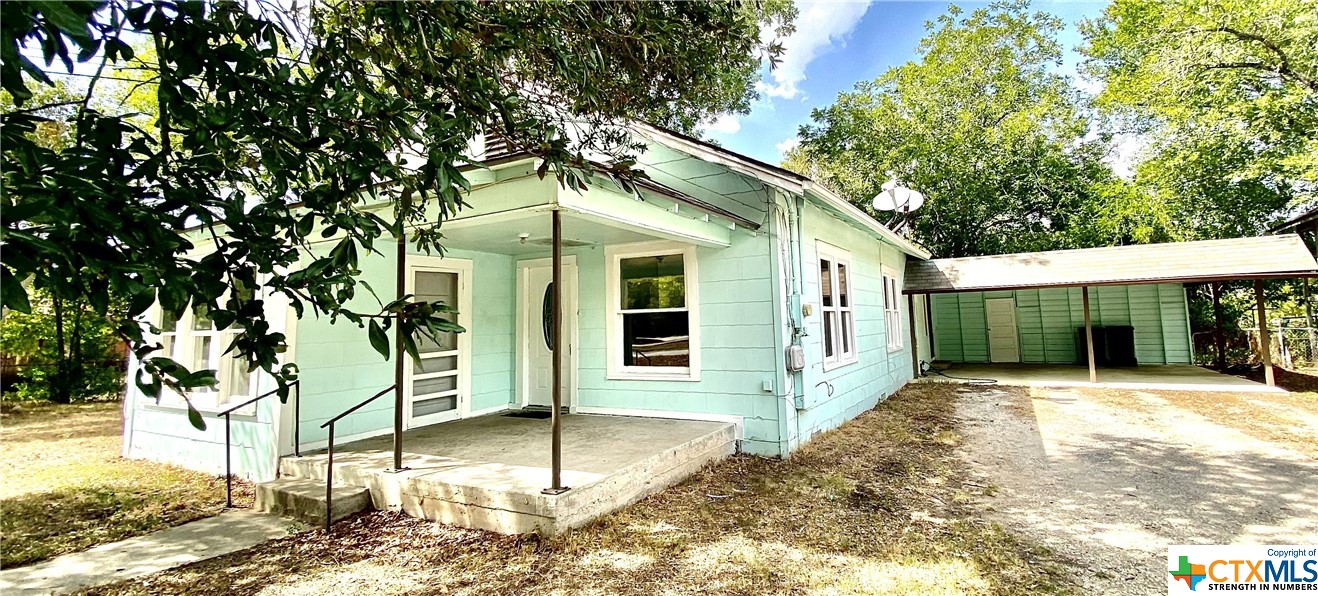 a front view of a house with a porch