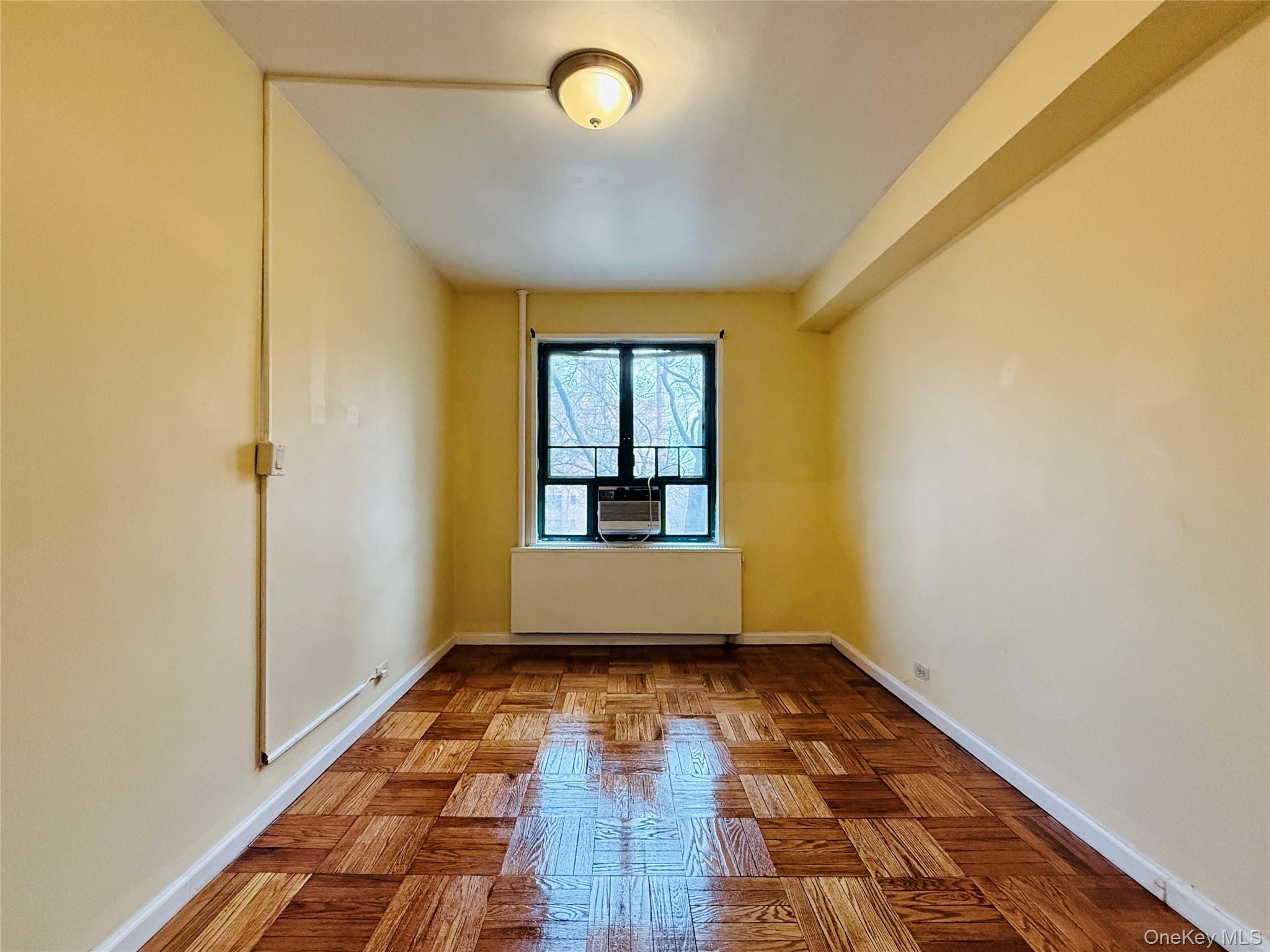 1576 Unionport Road, Unit 5F Bronx, NY 10462 - Photo 13 of 14 a view of hallway with a window