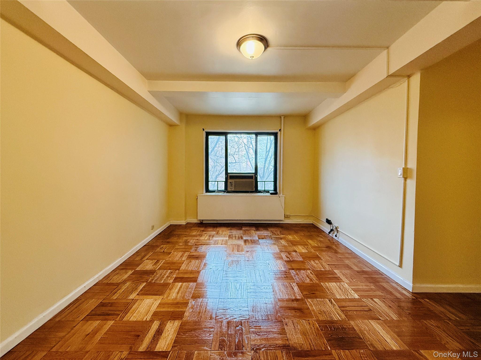 1576 Unionport Road, Unit 5F Bronx, NY 10462 - Photo 4 of 14 a view of hallway with wooden floor