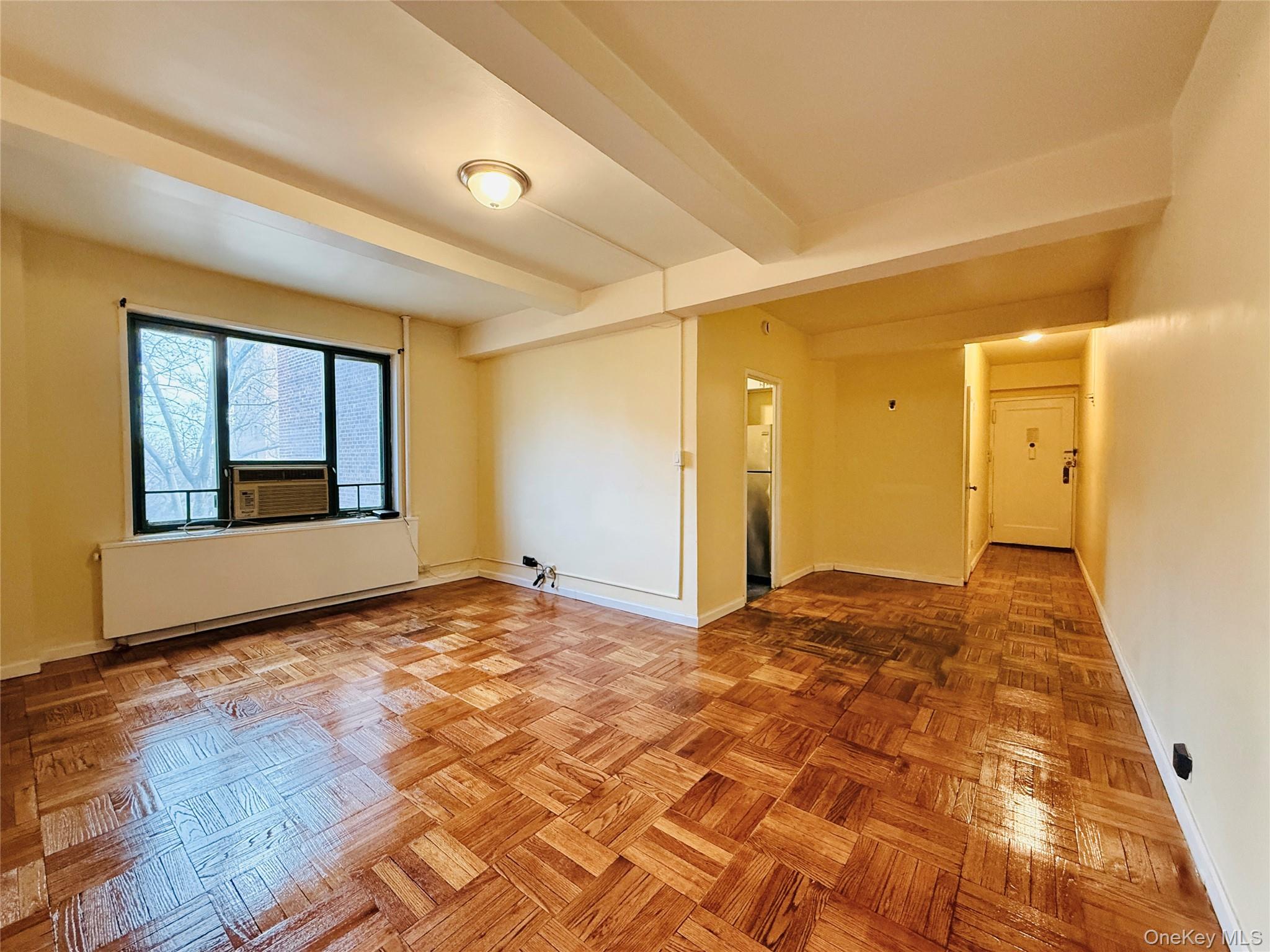 1576 Unionport Road, Unit 5F Bronx, NY 10462 - Photo 5 of 14 a view of an empty room and window