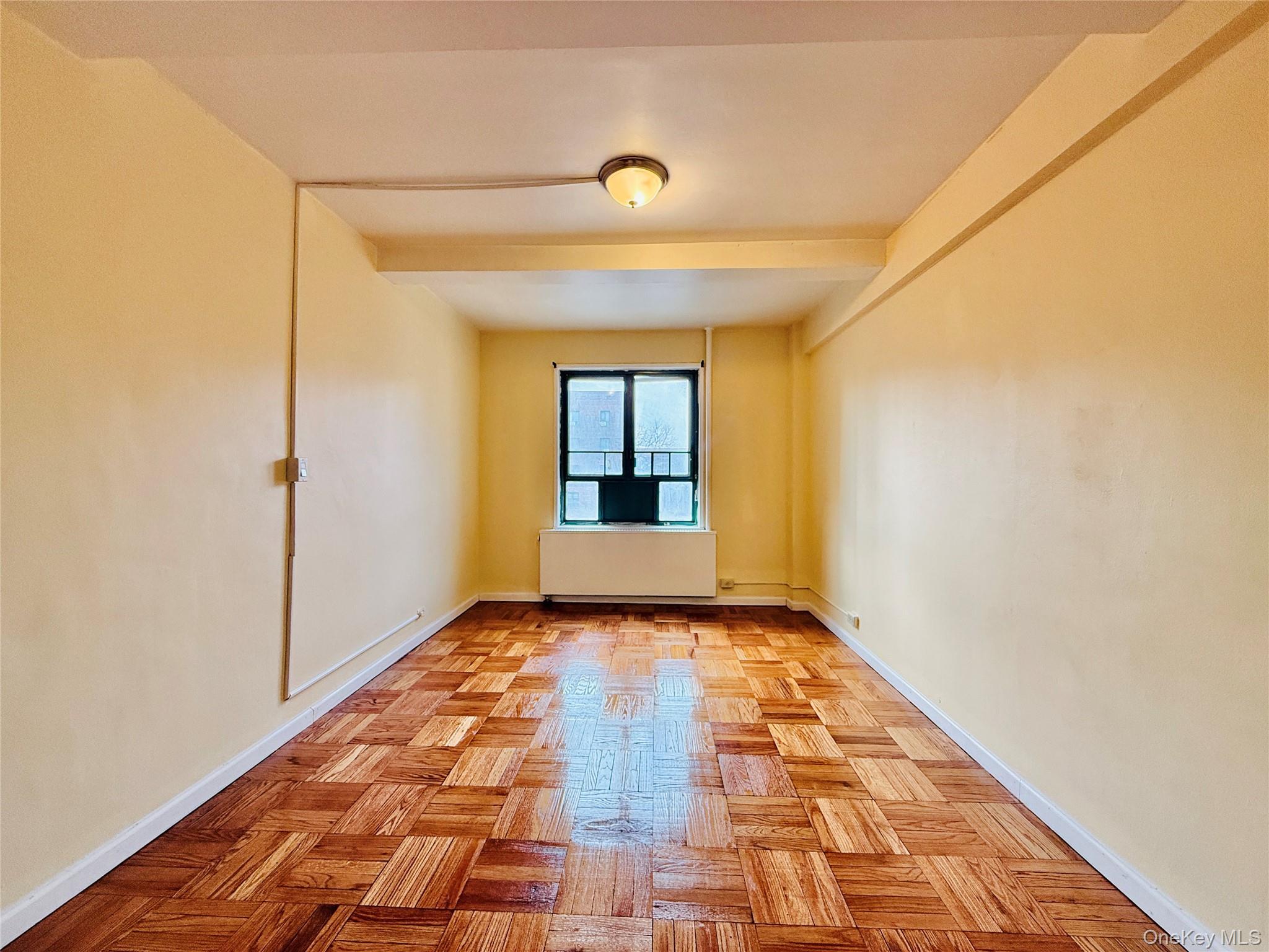 1576 Unionport Road, Unit 5F Bronx, NY 10462 - Photo 10 of 14 a view of hallway with wooden floor