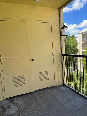 a view of a door and a window