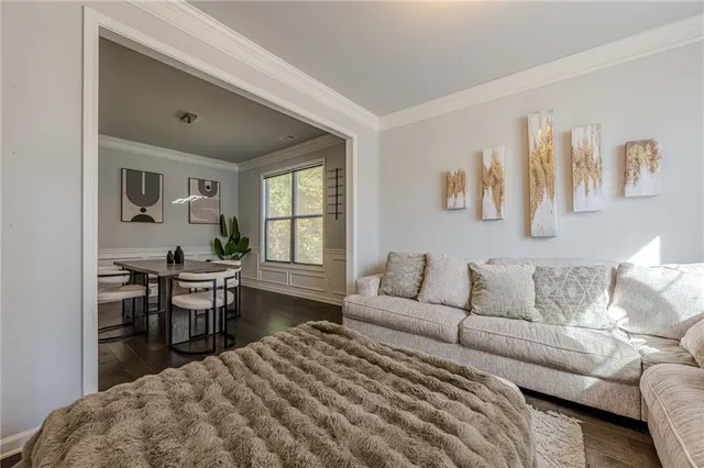 a bedroom with a bed and a table in it