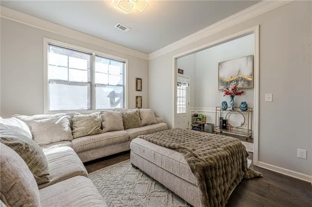 a view of a livingroom with furniture and wooden floor