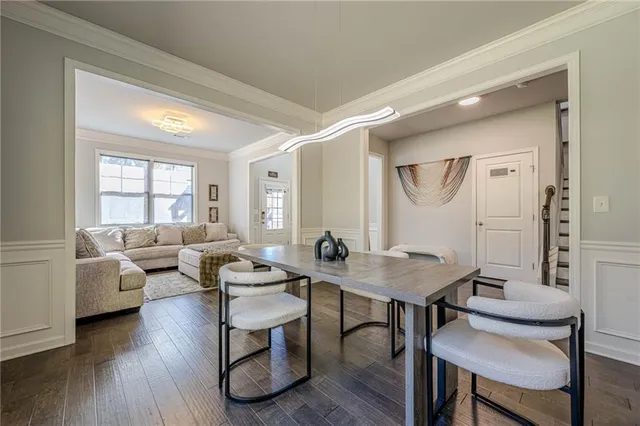 a view of entryway and hall with wooden floor