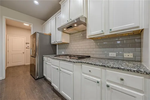 a bedroom with a large bed and a walk in closet