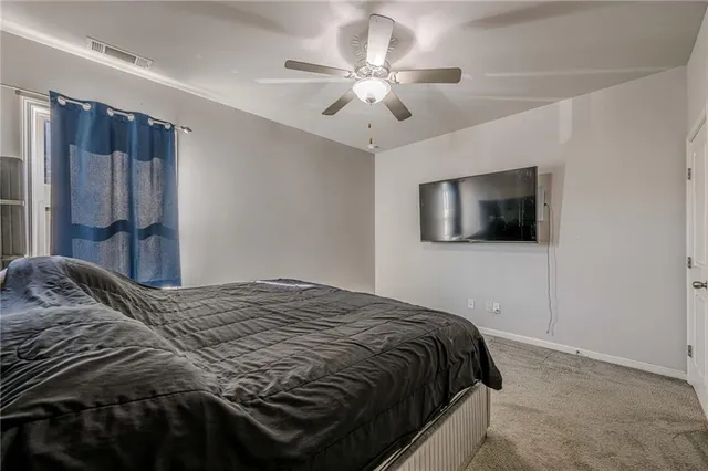 a view of house with yard and sitting area