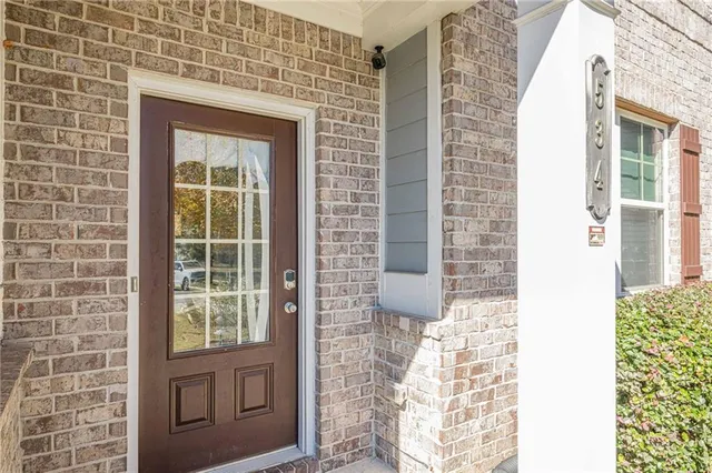 a view of a livingroom with furniture and a potted plant