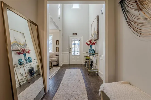 a living room with furniture a rug and a table