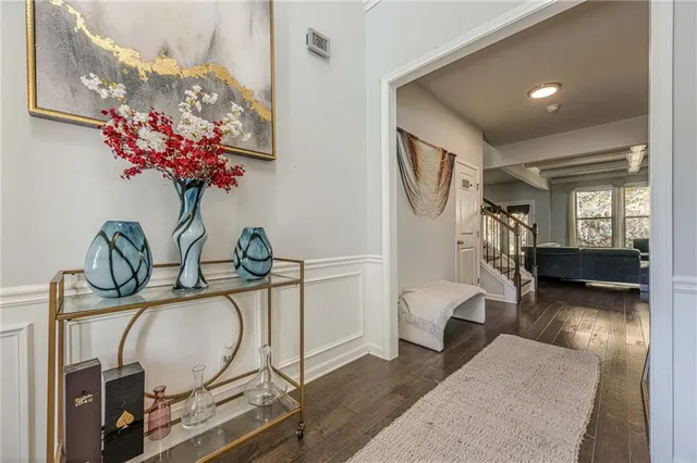 a bedroom with a large bed couch and a window