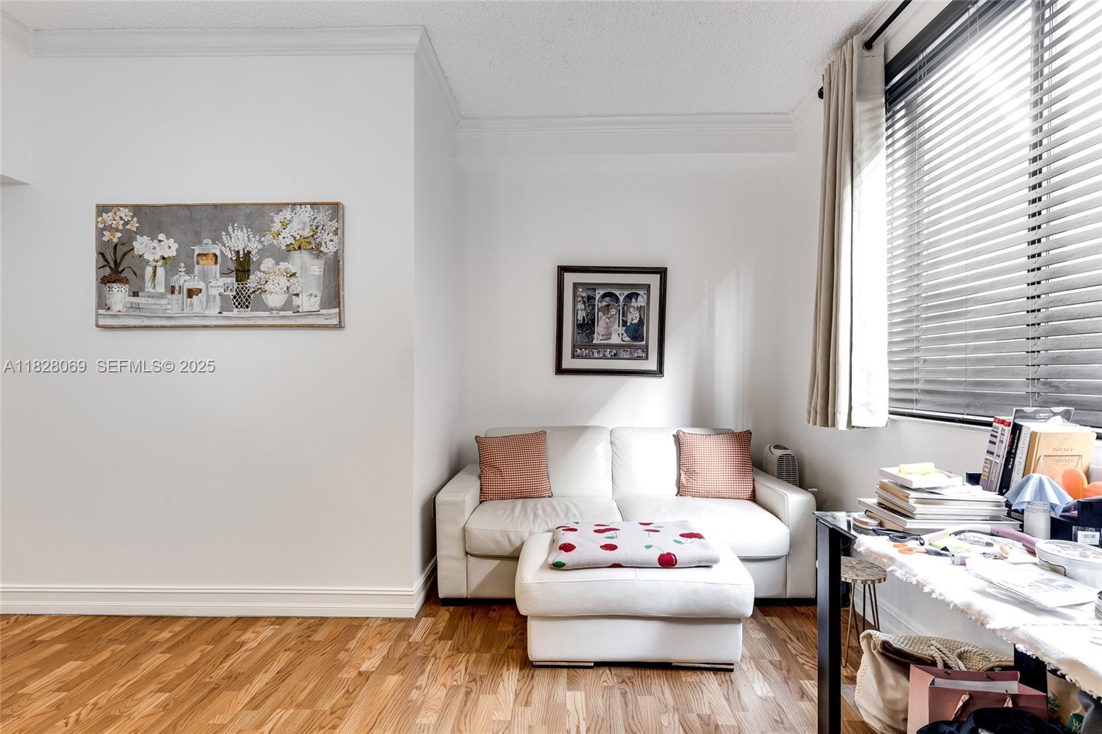 540 Brickell Key Drive, Unit 210 Miami, FL 33131 - Photo 2 of 12 a living room with furniture and window