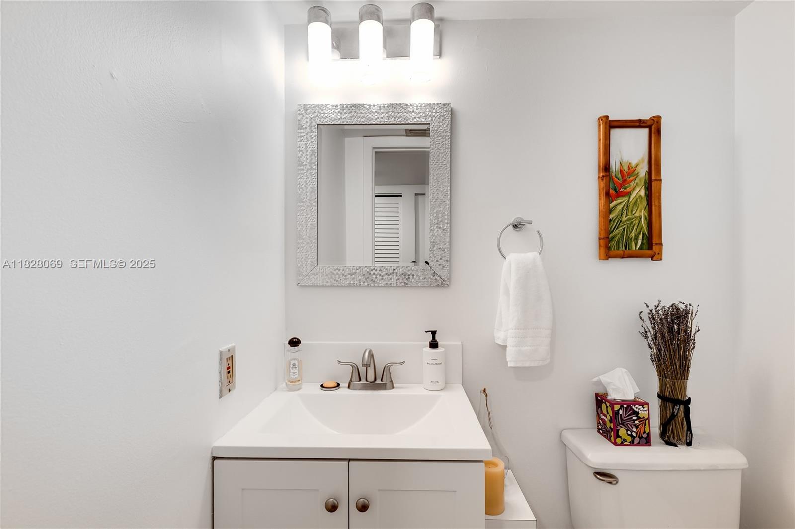 540 Brickell Key Drive, Unit 210 Miami, FL 33131 - Photo 3 of 12 a bathroom with a sink and a mirror