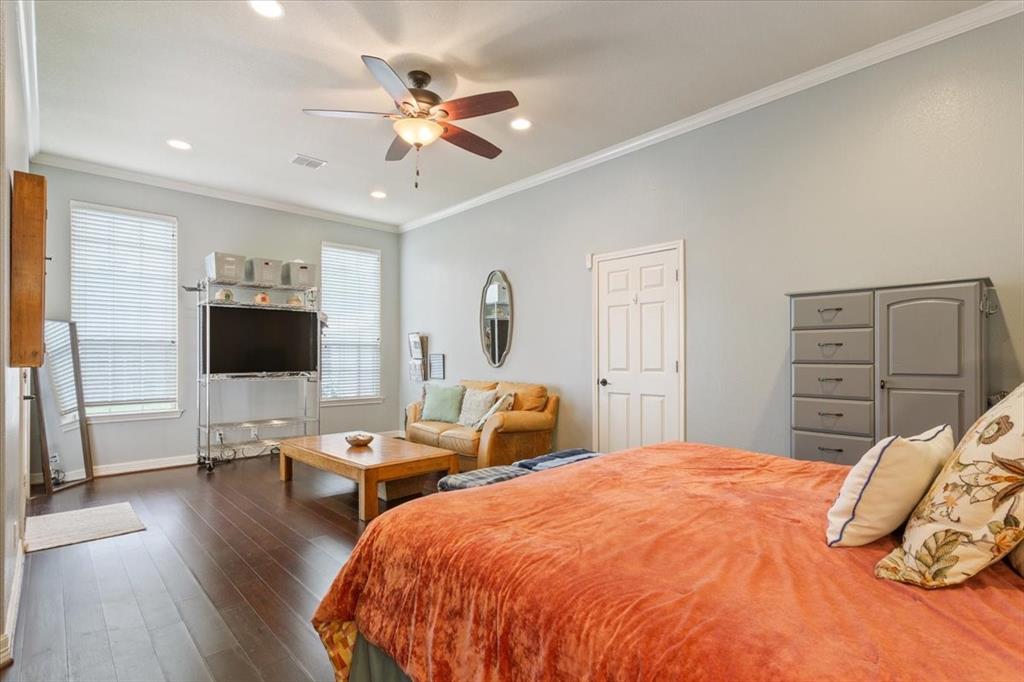 5616 Landsdown Drive Waco, TX 76708 - Photo 15 of 33 a bedroom with a bed and wooden floor