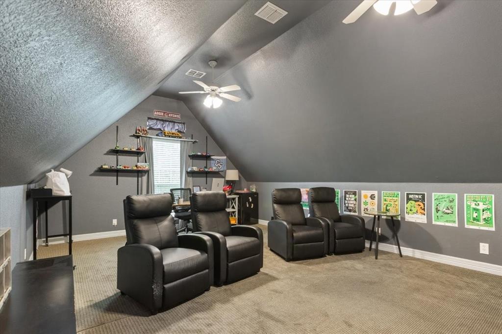 5616 Landsdown Drive Waco, TX 76708 - Photo 22 of 33 a living room with furniture a ceiling fan and a window