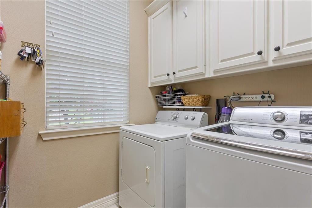 5616 Landsdown Drive Waco, TX 76708 - Photo 25 of 33 a utility room with dryer and washer