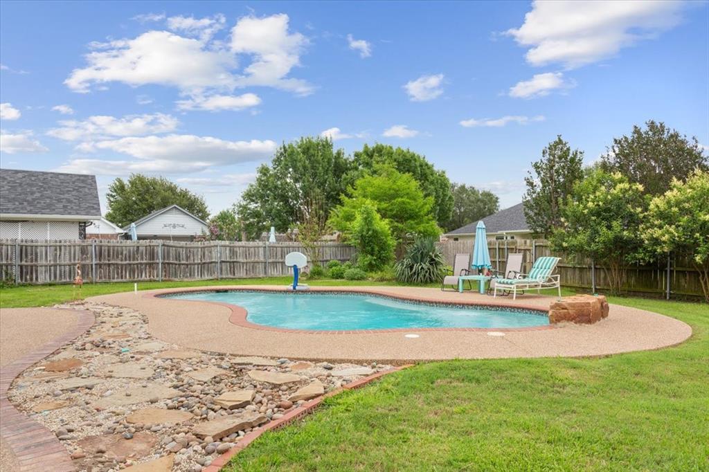 5616 Landsdown Drive Waco, TX 76708 - Photo 27 of 33 a view of a house with a yard and swimming pool