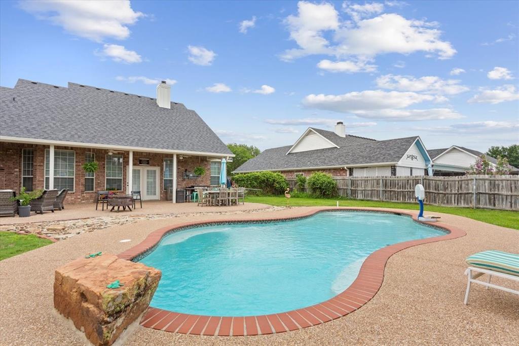 5616 Landsdown Drive Waco, TX 76708 - Photo 28 of 33 a view of a house with swimming pool and a yard