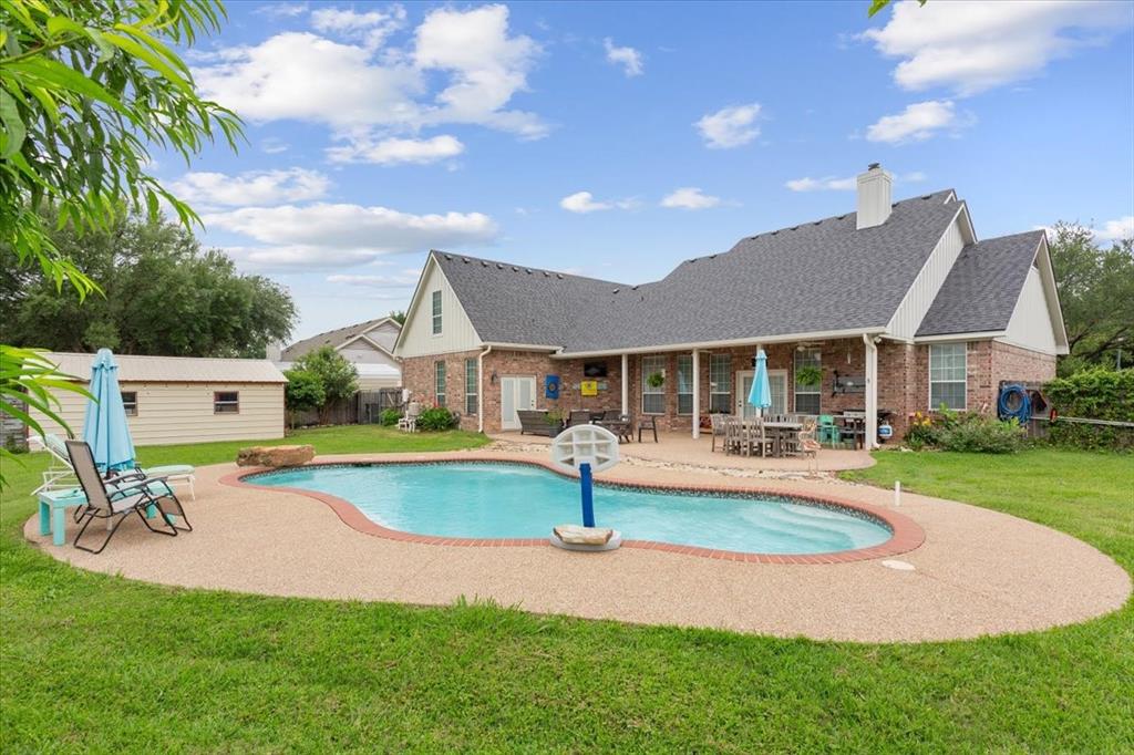 5616 Landsdown Drive Waco, TX 76708 - Photo 29 of 33 a front view of a house with swimming pool having outdoor seating