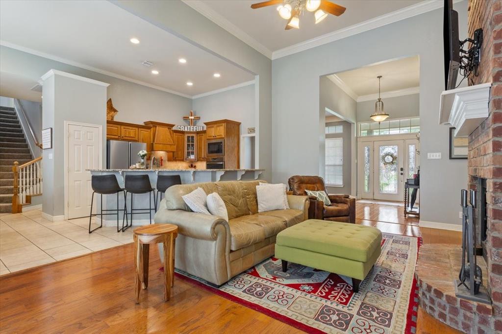 5616 Landsdown Drive Waco, TX 76708 - Photo 6 of 33 a living room with furniture and a chandelier