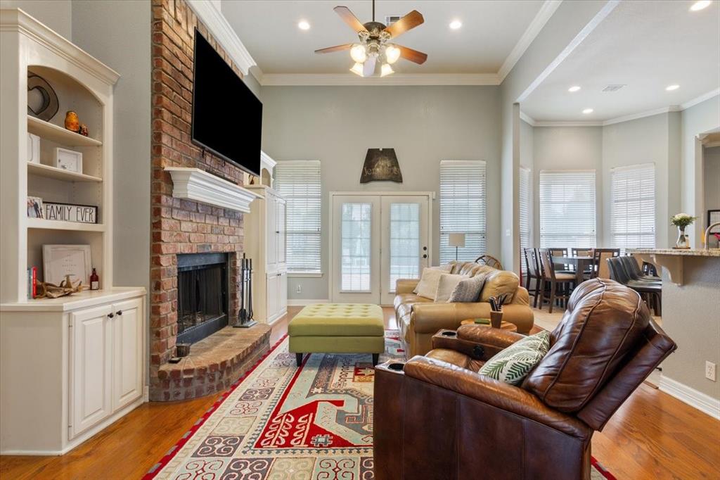 5616 Landsdown Drive Waco, TX 76708 - Photo 8 of 33 a living room with furniture fireplace and flat screen tv