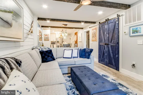 a bedroom with a bed and a large mirror with a flat tv screen