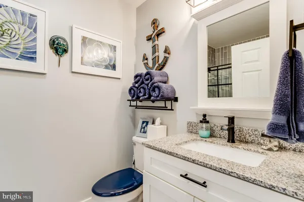 a bedroom with bed and wooden floor