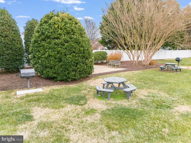 an aerial view of residential houses with yard