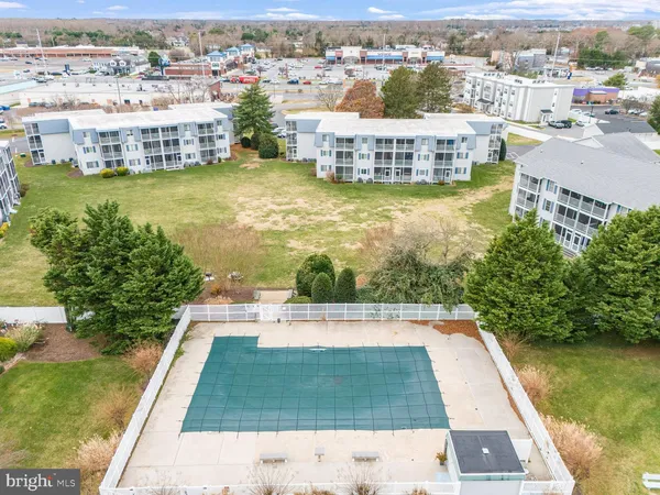 an aerial view of residential houses with city view