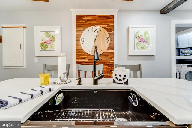 a kitchen that has a lot of cabinets and refrigerator