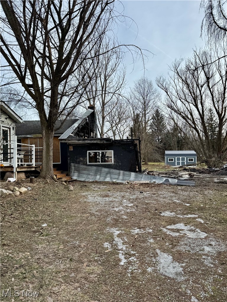 6573 Williams Road Painesville, OH 44077 - Photo 5 of 32 View of yard featuring an outbuilding