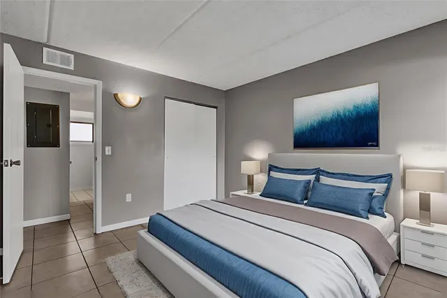 a bedroom with bed and window