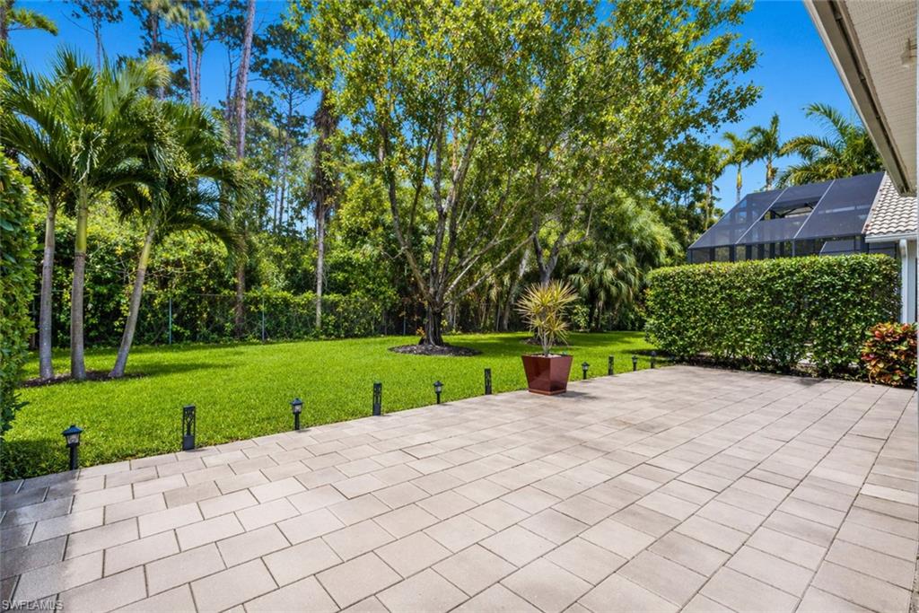 6051 Shallows Way Naples, FL 34109 - Photo 2 of 38 a view of a park with large trees